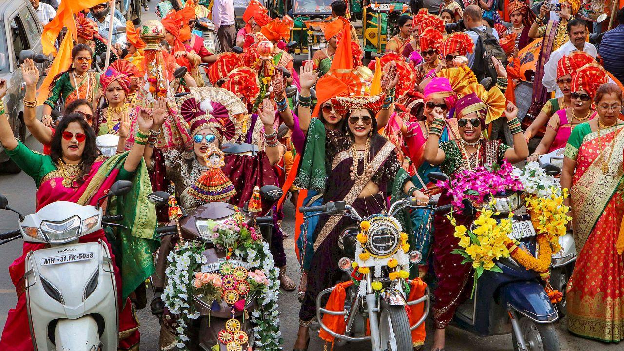 Women participate in a bike rally organised on the eve of 'Gudi Padwa' festival, in Nagpur on Monday. (ANI Photo)